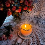 Coffee candle large pillar burning demonstration with coffee beans and copper snuffer on lace