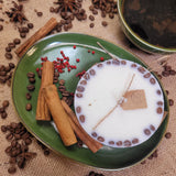 Beauty Scents large coffee candle with coffee beans decoration on green plate with cinnamon sticks and spices