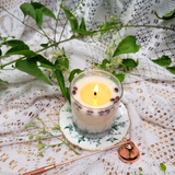 Large glass coffee bean candle burning after 3 hours showing wax pool and flame