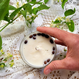 Top view of large glass coffee bean candle showing coffee beans arrangement and wick