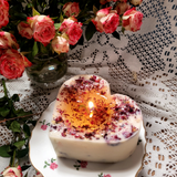 Large heart-shaped rose petals scented candle burning with golden flame on antique rose-patterned china - Beauty Scents handmade soy candle