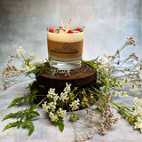 Large glass raspberry candle top view showing red berry arrangement in glass container