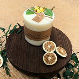 Large lemon pillar candle lifestyle view showing citrus-scented candle in modern home décor