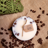 Coffee beans embedded in small candle wax showing natural botanical decoration technique