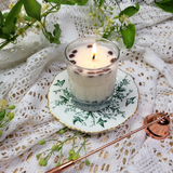 Small glass coffee bean candle top view showing coffee beans arrangement and wick