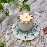 Small glass coffee bean candle elegant lifestyle shot with coffee bean decoration