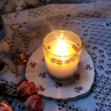 Small glass coffee bean candle final lifestyle shot with natural coffee beans in glass