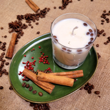 Side view of small glass coffee bean candle showing natural coffee beans in glass container