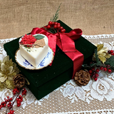 Small heart Winter Poinsettia candle angle view displaying handcrafted soy wax heart shape