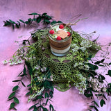Small glass raspberry candle profile view with red wax berry decorations - available in 4 scents