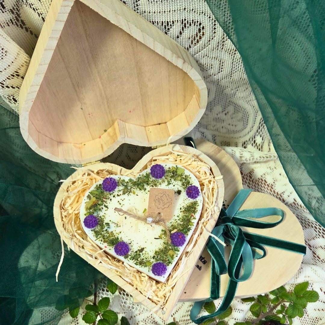 Detailed view of wooden heart box and blackberry candle, perfect gift