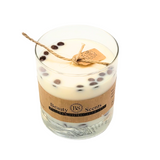 Large glass coffee bean candle with natural coffee beans decoration on clear background