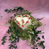 Large heart raspberry candle alternative angle showing red wax berries on heart-shaped candle