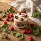 Wax candle with raspberries and leaves on a wooden surface, branded 'BS Beauty & Scents'.