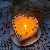 Large heart coffee bean candle burning progress showing romantic wax pool formation
