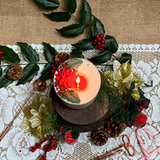 Large Winter Poinsettia candle lifestyle shot styled for Christmas home décor with Hollyberry fragrance