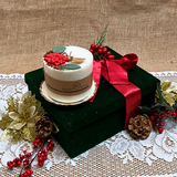 Large Winter Poinsettia candle angle view displaying handcrafted soy wax with festive decoration