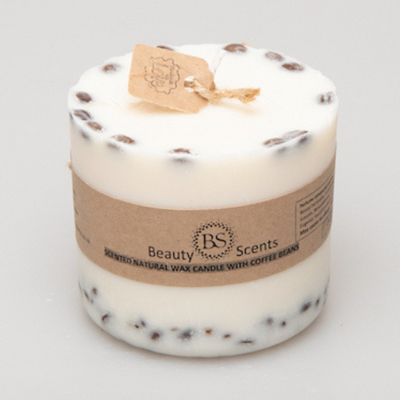 Large coffee bean pillar candle with natural coffee beans decoration on grey background