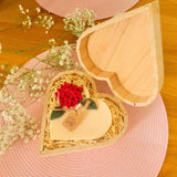 Large heart hollyberry candle in wooden heart-shaped gift box showing premium romantic packaging with natural wood shavings