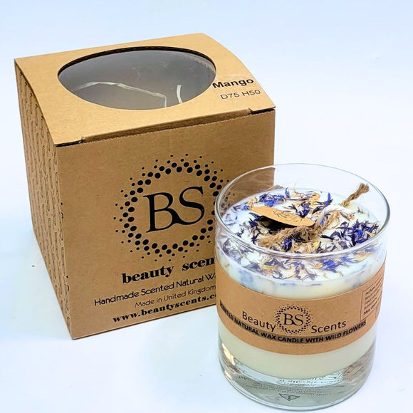 Glass candle with natural wax and wildflowers next to its packaging box, both featuring 'Beauty Scents' branding.