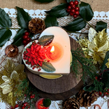 Large heart Winter Poinsettia candle lifestyle shot styled for Christmas romance with Hollyberry fragrance