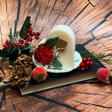 Large heart Winter Poinsettia candle angle view displaying handcrafted soy wax heart shape
