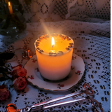 Medium coffee bean candle burning showing gentle flame and wax pool