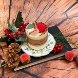 Medium Winter Poinsettia candle lifestyle styling with Christmas home décor and Hollyberry fragrance