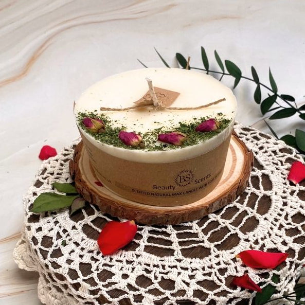  medium pillar candle decorated with real rose buds, handmade by Beauty Scents, rustic country-style setting