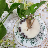 Coffee beans embedded in small candle wax showing natural botanical decoration technique