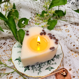 Small heart coffee bean candle burning progress showing romantic wax pool formation