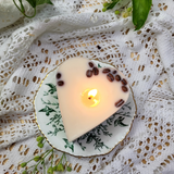 Small heart coffee bean candle lifestyle shot with natural lighting and heart shape