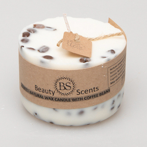 Small coffee bean candle with natural coffee beans decoration on grey background