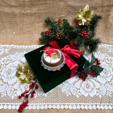 Small Winter Poinsettia candle angle view displaying corner decoration style with red berries