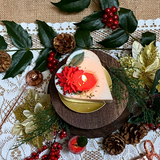 Small heart Winter Poinsettia candle lifestyle styling with Christmas décor and Hollyberry fragrance