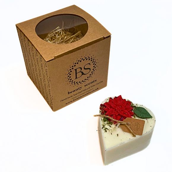 Small heart Winter Poinsettia candle with Hollyberry scent featuring red poinsettia flowers and green leaves