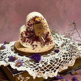 Small heart-shaped rose petals scented candle with crushed dried flowers on rustic wooden base - Beauty Scents handmade soy candle