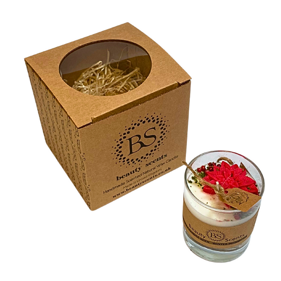 Small glass Winter Poinsettia candle with Hollyberry scent featuring red poinsettia flowers and green leaves