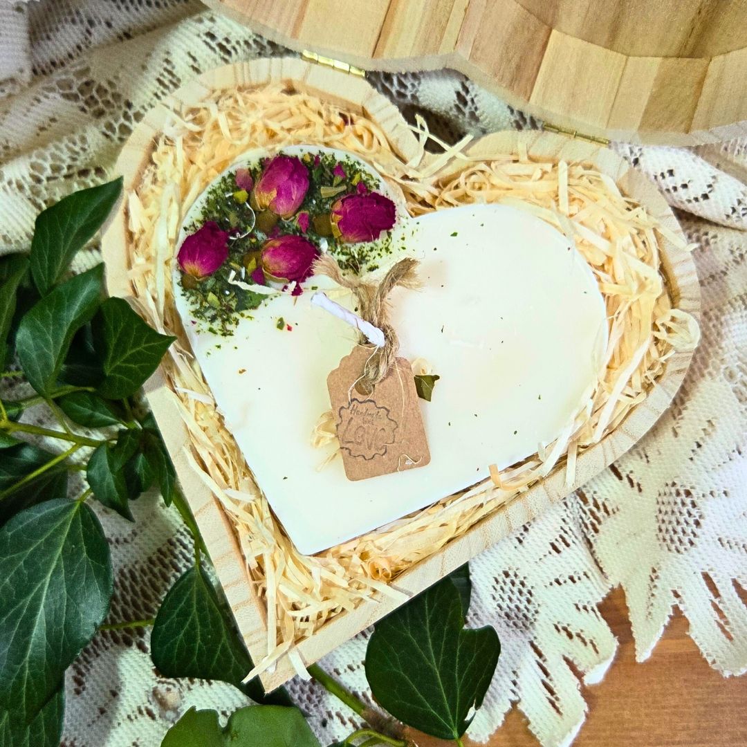 Close-up of rose bud heart candle in eco-friendly wooden box