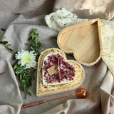 Wooden heart box with handmade candle and rose petal decoration