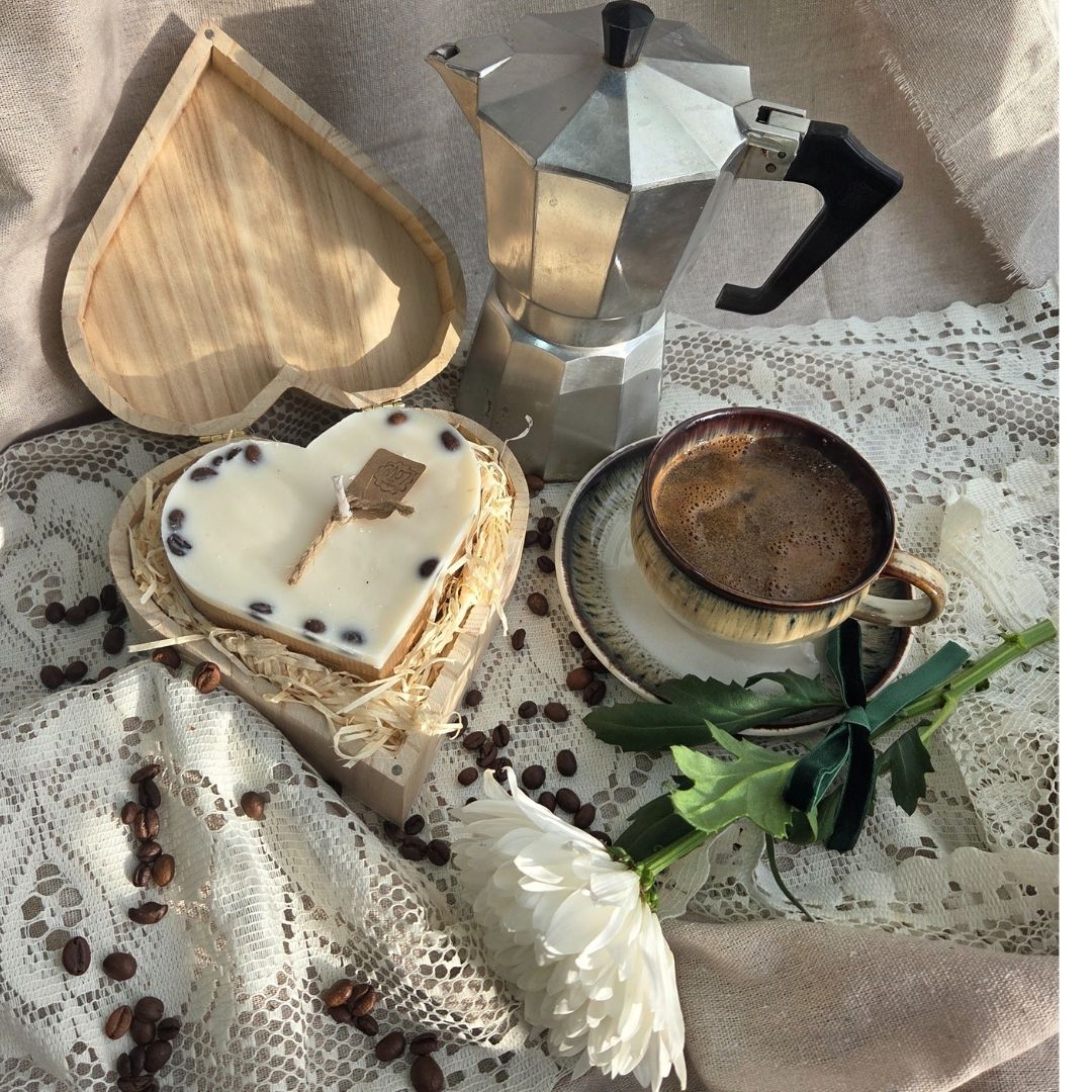Detailed view of coffee bean candle texture in heart-shaped wooden box