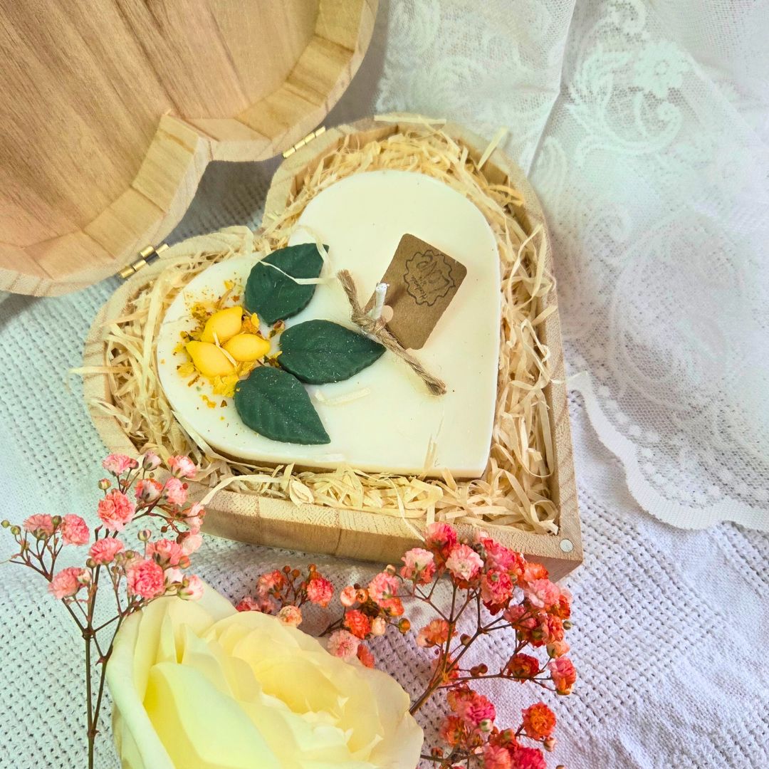 Close-up of lemon heart candle in eco-friendly wooden box