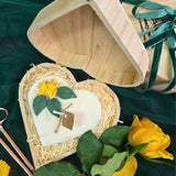 Handmade heart candle decorated with lemons, set in rustic wooden box