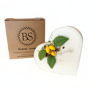 Large heart lemon candle on white background showing clear product details and romantic heart shape