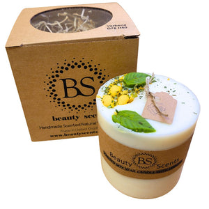 Candle with decorative elements and 'BS Beauty Scents' packaging on a white background