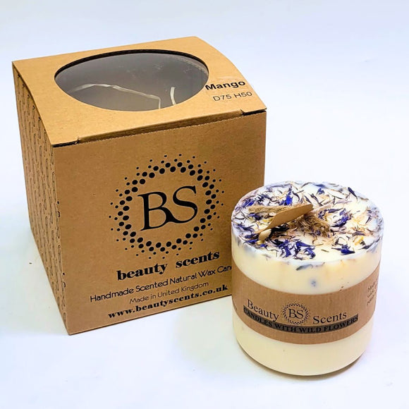 Candle with decorative elements and 'BS beauty scents' packaging on a white background