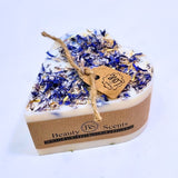 Small Heart Wild Flowers handmade soy candle 300g with blue cornflowers decoration, natural twine wick and Beauty Scents label - heart-shaped clean white background product photography